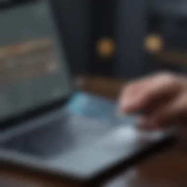 Reviewing Credit Card Benefits A person reviewing benefits of credit cards on a laptop.